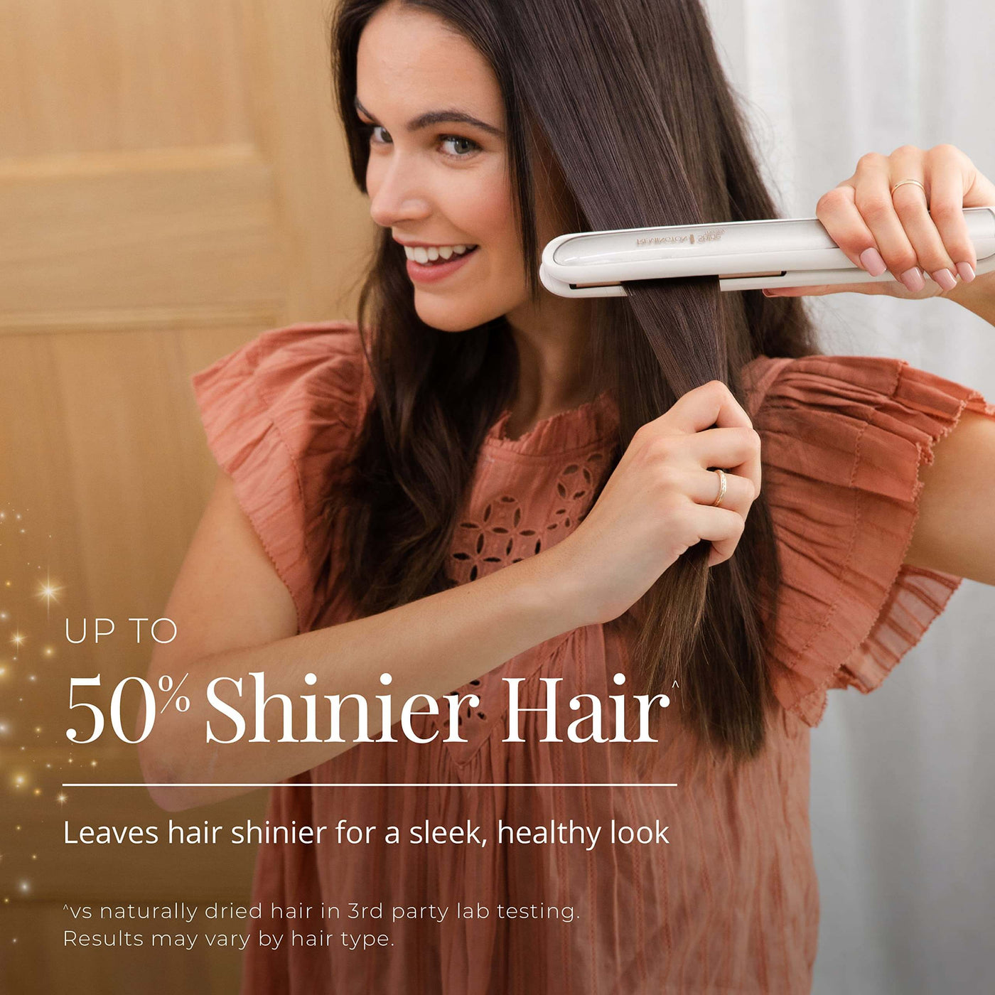 Model using Remington Shine Therapy hair straightener for 50% shinier hair and a sleek, healthy look.